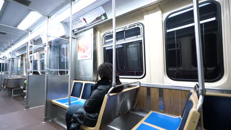 Static-shot-of-person-riding-subway-train-in-downtown-Chicago