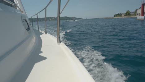 View-from-the-side-of-a-speeding-boat-breaking-the-waves