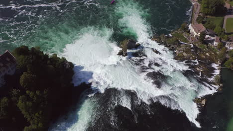 Revealing-aerial-shot-starting-at-birdseye-then-swivel-to-show-the-area-around-the-Rheinfall-in-Switzerland