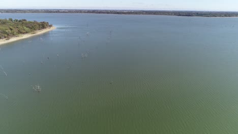 Aerial-video-of-Lake-Lavon-on-the-North-West-side-flying-over-trees-in-the-water