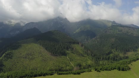 Deforestation-View-Over-Cloudy-Sky-in-the-High-Tatras-Mountain-Surrounded-By-Green-Trees-in-Slovakia---Aerial-shot