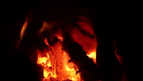 A-steady-slow-motion-shot-of-Forest-fires-burning-with-hot-coals-and-embers-to-continue-to-spread