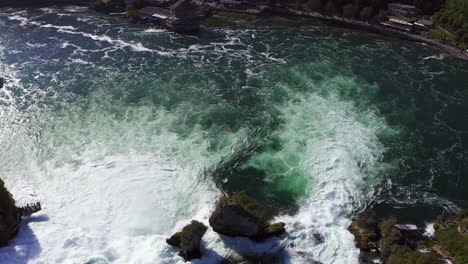 Slow-Motion:-revealing-aerial-shot-of-the-roaring-waterfall-Rheinfall-at-Schaffhausen-in-Switzerland