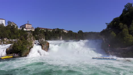 Slow-Motion:-Approaching-shot-over-the-roaring-waterfall-Rheinfall-Schaffhausen-in-Switzerland