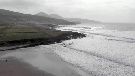Aerial:-Rising-drone-at-St-Finians-Bay-in-ireland-on-stormy-day,-Ring-of-Kerry