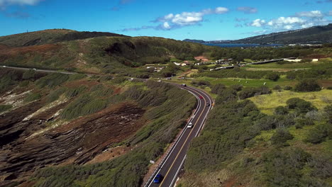 Drone-footage-of-traffic-on-Kalaniana’ole-highway,-near-Kahauloa-cove-and-Lanai-lookout-on-the-southeast-side-of-Oahu,-Hawaii