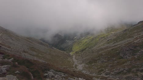 Footage-View-From-Hiking-Trail-To-Krivan-in-Slovakia-With-Fog-Clouds-and-Rocks---Wide-Shot
