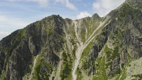 Breathtaking-Scenery-of-Green-Rocky-Mountain-Near-Skok-Waterfall-High-Tatras-in-Slovakia---Aerial-Shot