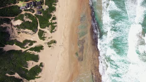 Birds-Eye-Forward-Flying-Shot-of-Chidenguele-Beach-in-Mozambique