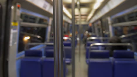 Metal-handle-close-up-in-an-empty-subway-wagon