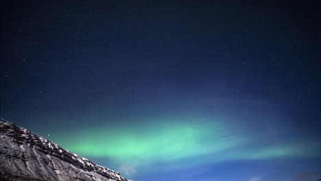 Amazing-time-lapse-of-Aurora-Borealis-northern-lights-shining-at-night-in-Iceland,-Westfjords