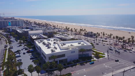 Drone-footage-taken-in-Huntington-Beach-California-of-Pacific-City-with-a-view-of-Pacific-Coast-Highway-and-the-Pacific-Ocean