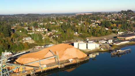 Sunny-Aerial-of-Coos-Bay,-Oregon-Pacific-Northwest-coastal-lumber-mill