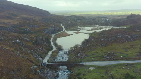 Aerial-view-of-the-Wishing-Bridge,-located-in-the-Gap-of-Dunloe,-Co-Kerry,-Ireland