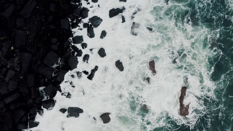 Cinematic-Top-Down-Aerial-of-Ocean-Sea-Waves-Crashing-on-Rocky-Coast