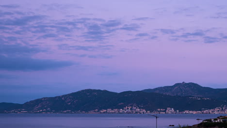 Time-lapse-of-the-sunrise-over-Villanova-mountains---the-city-of-Ajaccio-in-Corsica,-France,-in-the-summer