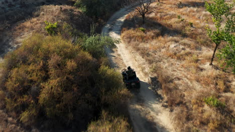 Young-woman-riding-a-quad-bike-along-the-trails-of-Cappadoica,-Turkey