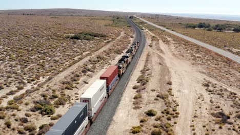 A-Bright-Sunny-Day-On-Scenic-Railroad-With-A-Train-Running-Through-the-Desert,-United-States---Aerial-View