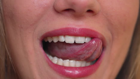 Healthy-woman-licking-her-amazing-white-teeth