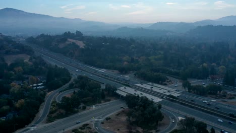 Time-lapse-of-early-morning-traffic-in-the-smoke-filled-hills-of-the-valley