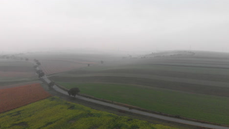 Misty-agricultural-field-landscape-in-Austria,-ziersdorf,-aerial-view