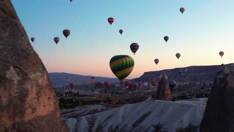 Early-morning-silhouetted-hot-air-balloons-against-the-skies-of-Goreme-Cappadocia,-Turkey