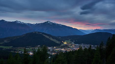 Late-sunset-timelapse-over-the-town-of-Seefeld-in-Tirol-and-the-mountains-of-the-Alps,-Austria