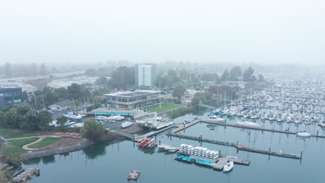 A-foggy-display-of-marina-sailboats-with-partial-visibility
