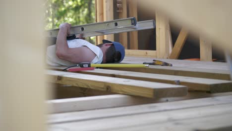 Injured-man-with-broken-arm,-accident-at-construction-site,-static-shot
