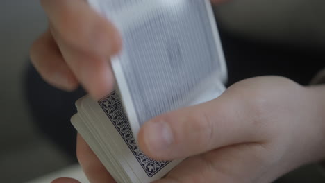 Hands-shuffle-a-deck-of-playing-cards-poker-game-close-up