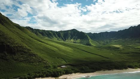 Aerial-shot-of-the-beautiful-Makua-Valley-and-Makua-Beach-on-a-sunny-day-on-West-Oahu,-Hawaii