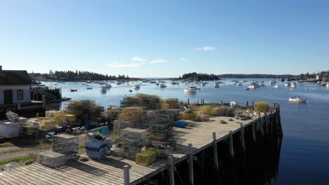 Aerial-Low-Fly-Over-Drone-Footage-of-Lobster-Traps-in-Vinalhaven,-Fox-Islands,-Knox-County-Maine,-USA