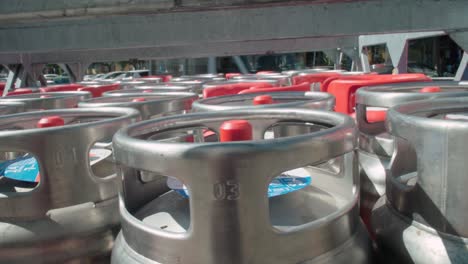 Butane-gas-bottle-canisters-in-delivery-truck,-Close-Up-Slider-Right