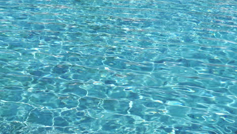 Wide-shot-of-small-waves-moving-through-a-pool