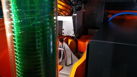 Orange-juice-machine-oing-through-the-process-of-selecting-and-cutting-oranges