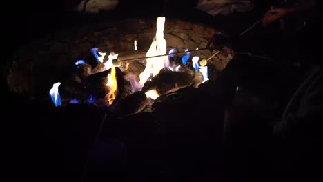 Roasting-marshmallows-on-sticks-over-a-fire-pit