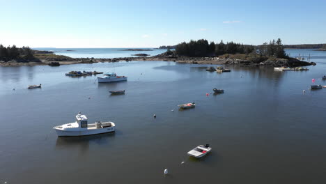 Aerial-Fly-By-Drone-Footage-over-parked-boats-at-Vinalhaven,-Maine-Coast,-Fox-Islands,-Knox-County,-Maine,-USA