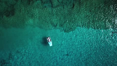 Timelapse-of-a-Small-Boat-Moving-over-a-Coral-Reef-found-in-Crystal-Clear-Waters