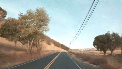 Driving-fast-across-the-rolling-hills-in-a-time-lapse-video