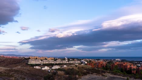 Cloudy-moon-rise-time-lapse,-marbella,-malaga,-spain,-dramatic-clouds-moving-in-4k