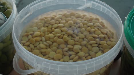 Closeup-Detail-Shot-of-Superfood-Yellow-Lupin-or-Lupini-Beans-in-Brine