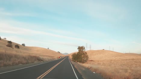 A-long-time-lapse-video-of-driving-in-the-country-hills