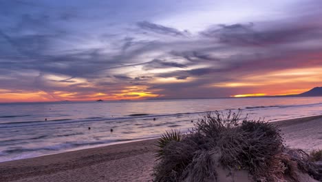 Time-lapse-Marbella-costa-del-sol-sunset,-beauitful-magical-sunset-with-beach-in-foreground-and-amazing-colorful-sunset