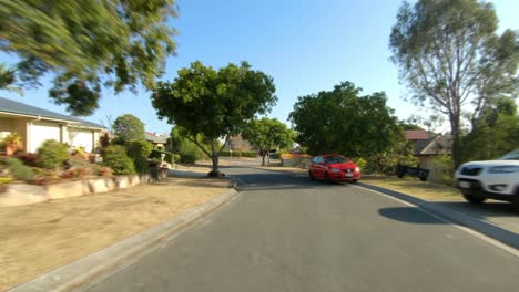 Rear-facing-driving-point-of-view-POV-of-quiet-Australian-suburban-city-street---ideal-for-interior-car-scene-green-screen-replacement