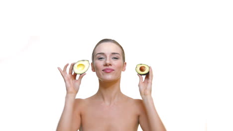 Young-naked-woman-with-avocado-in-hand