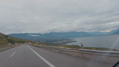 Drive-through-the-scenic-landscape-of-mountains,-sea-and-clouds-by-the-motorway-of-Slovenia,-A-view-by-the-car-front-screen