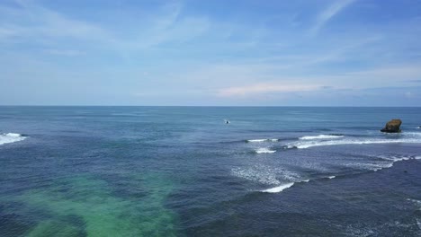 Aerial-view-of-fisherman-boat-on-clear-ocean-water-of-Indonesia-during-summer
