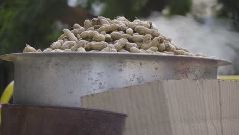 Steaming-hot-groundnuts-getting-cooked-in-steel-utensil