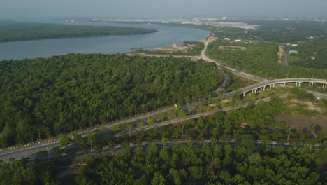 Toll-road-and-flyover-near-Bagan-Lalang-river,-Sepang,-Selangor,-Malaysia