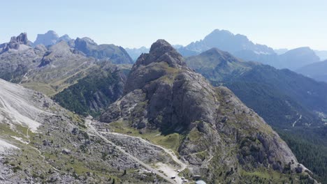 Mountain-road-surrounded-by-high-peaks,-Valparola-pass-in-Alta-Badia,-Dolomites